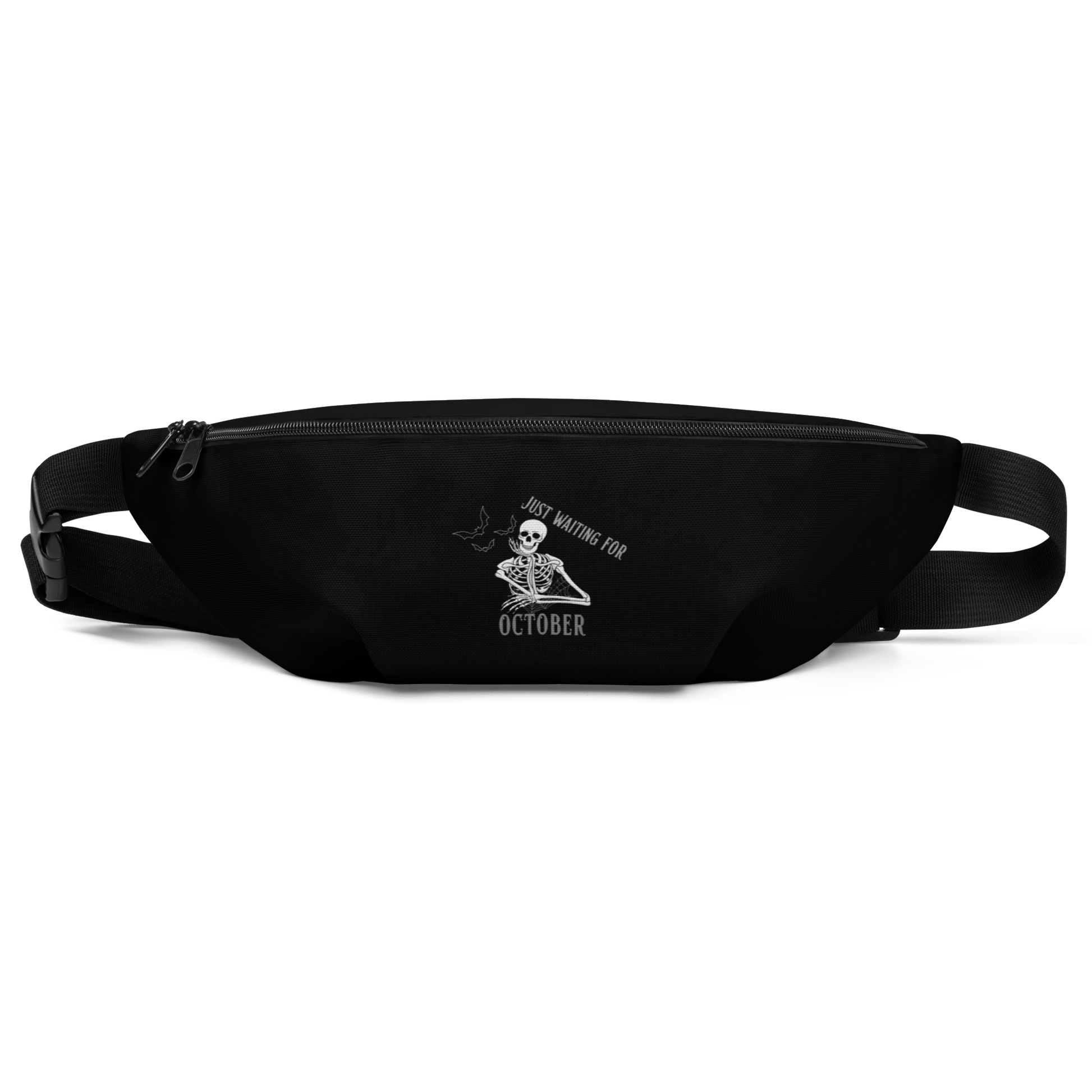 This is a black waist bag fanny pack that has a bored skeleton with his head resting in his hand and he has spider webs and bats around him and the text reads just waiting for October