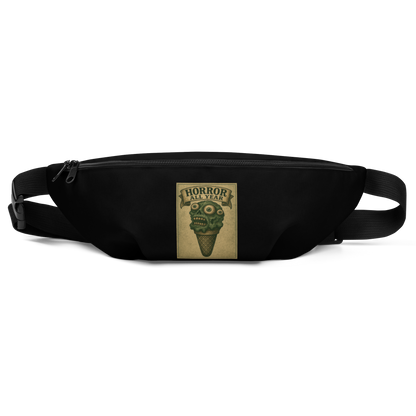 This is a black waist bag fanny pack that is a vintage-style illustration of a zombie-themed ice cream cone with a green, melting undead face and bulging eyeballs. Above the cone, a horror banner reads "Horror All Year" on a distressed parchment background