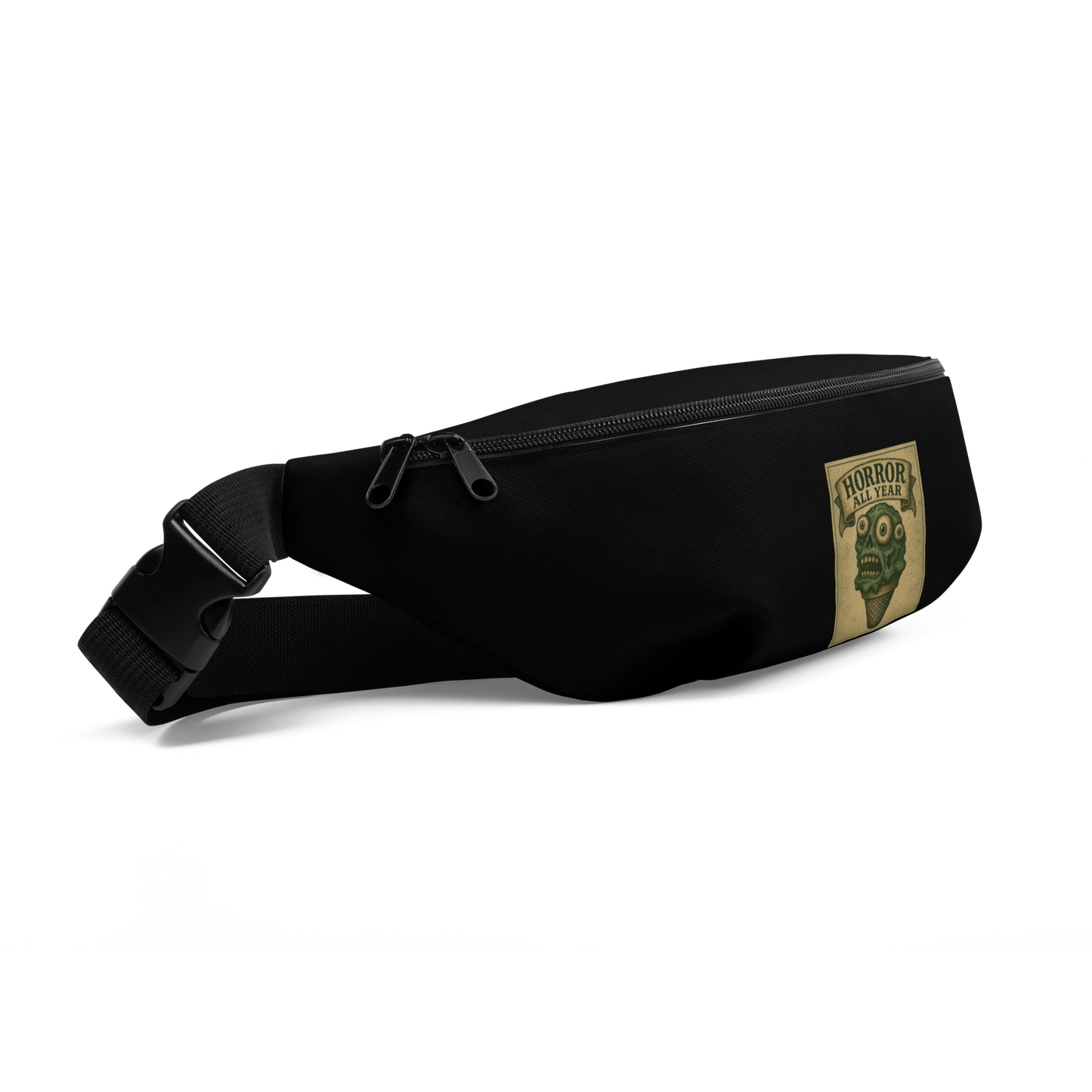This is the side of a black waist bag fanny pack that is a vintage-style illustration of a zombie-themed ice cream cone with a green, melting undead face and bulging eyeballs. Above the cone, a horror banner reads "Horror All Year" on a distressed parchment background