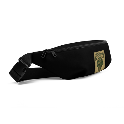 This is the side of a black waist bag fanny pack that is a vintage-style illustration of a zombie-themed ice cream cone with a green, melting undead face and bulging eyeballs. Above the cone, a horror banner reads "Horror All Year" on a distressed parchment background