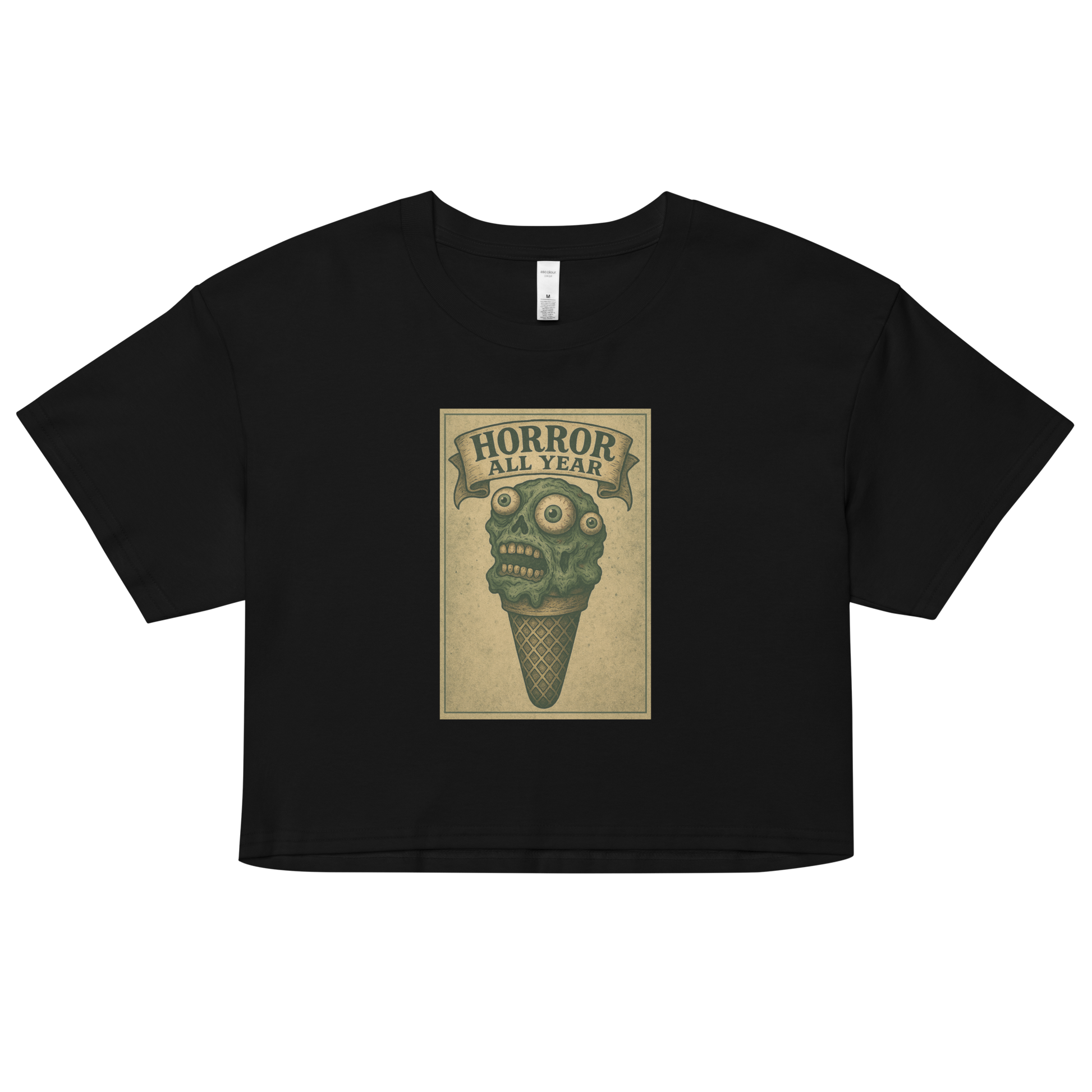 This a black crop top that is a vintage-style illustration of a zombie-themed ice cream cone with a green, melting undead face and bulging eyeballs. Above the cone, a horror banner reads "Horror All Year" on a distressed parchment background