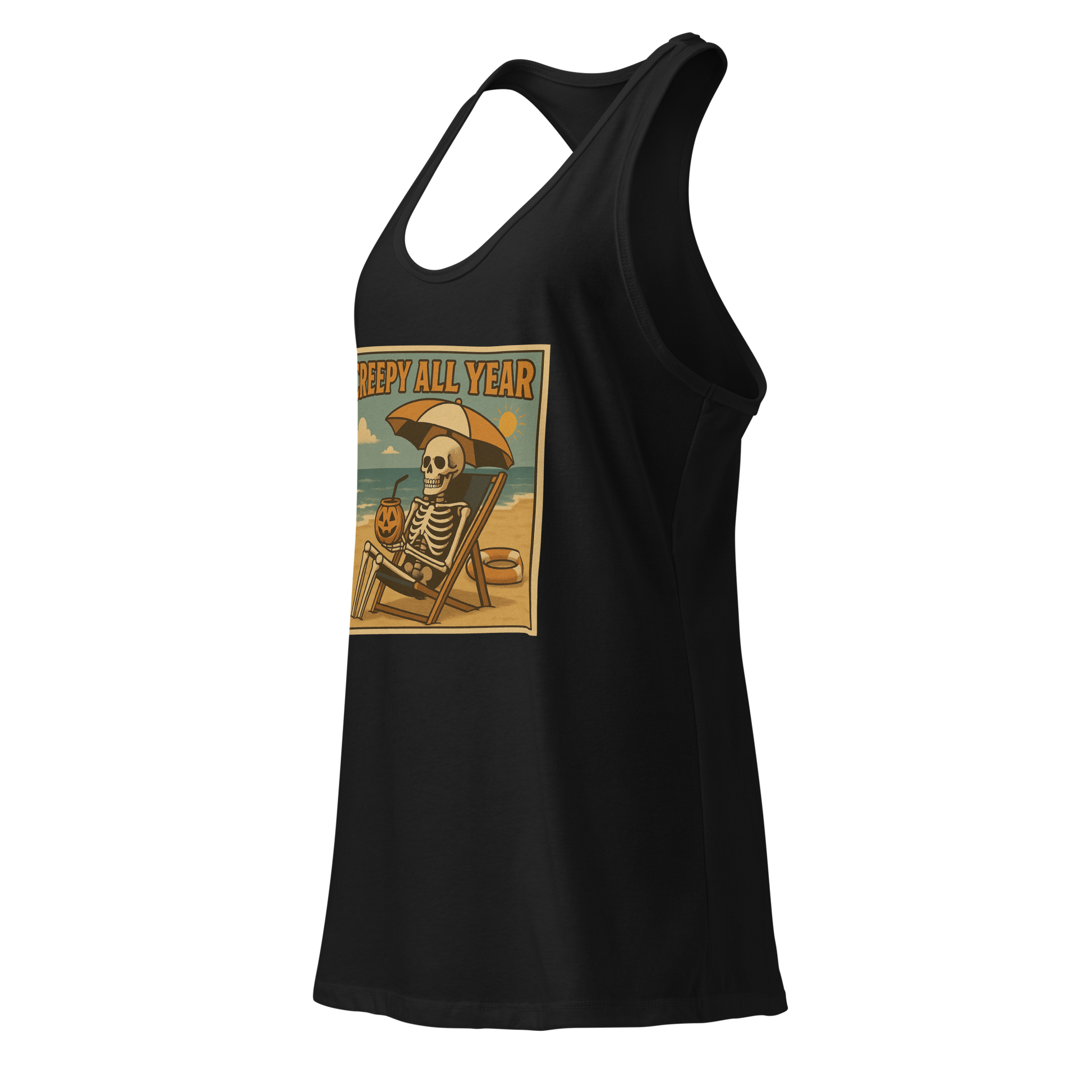 This is a black racerback tank top with a retro-style illustration of a grinning skeleton lounging on a beach chair under an orange umbrella. The skeleton is holding a pumpkin-shaped drink cup with a straw and relaxing by the ocean, with a bright sun in the sky and a life preserver in the sand. The words “Creepy All Year” appear boldly at the top 